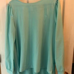 Light teal colored ladies’ dressy shirt